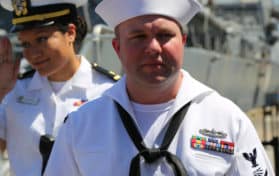 Unidentified officer on the deck of US guided missile destroyer USS Mitscher