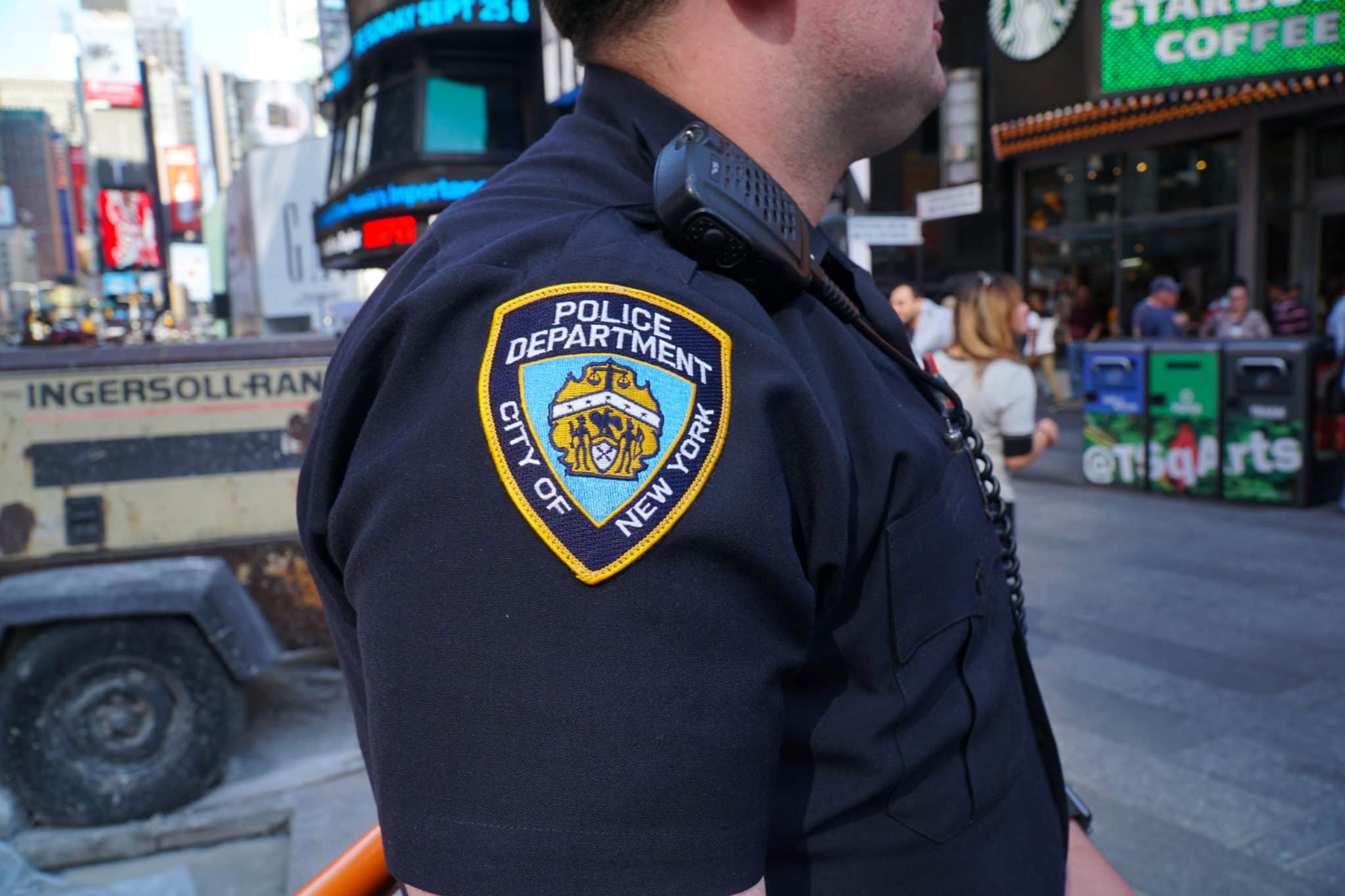 NYPD officer stands guard in Times Square Manhattan patrol