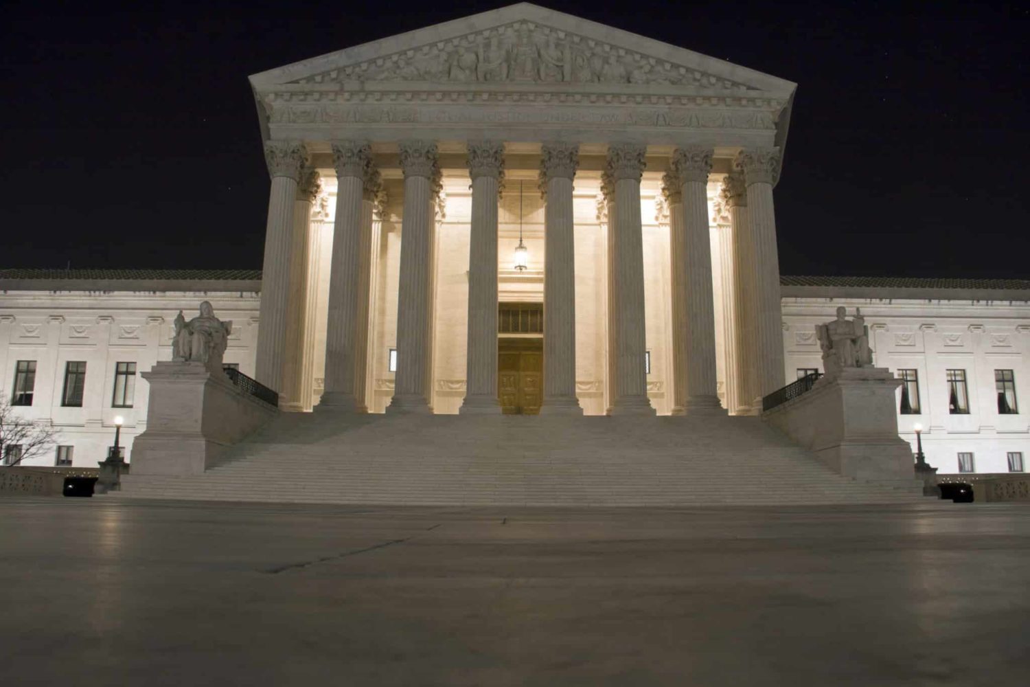 US Supreme Court building in Washington D C at night