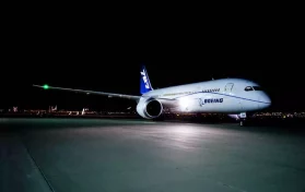 Boeing aircraft at night on runway