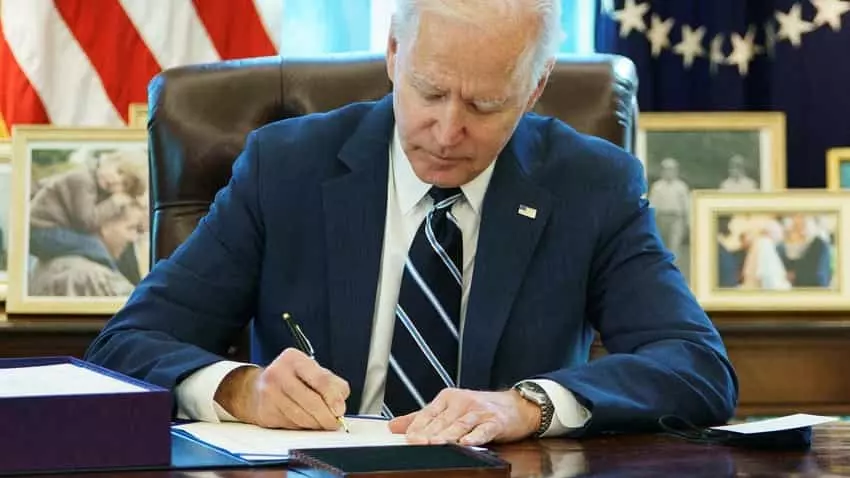Biden signing a bill