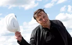 Elon Musk tipping helmet